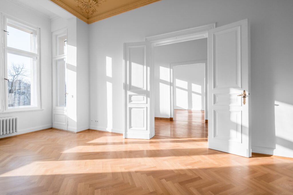 Empty room, flat with stucco ceiling and parquet floor Empty room, flat with stucco ceiling and parquet floor